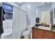 Bright bathroom featuring a shower-tub combo and sleek vanity with countertop at 932 Emerald Green Ct, Kissimmee, FL 34746