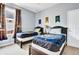 Bedroom with two twin beds and decorative banners on the wall at 932 Emerald Green Ct, Kissimmee, FL 34746