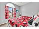 Bedroom with two twin beds, window, and mounted television at 932 Emerald Green Ct, Kissimmee, FL 34746