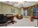 Charming dining area with tiled floors, decorative wall art, and natural light from the surrounding windows at 932 Emerald Green Ct, Kissimmee, FL 34746