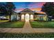 Inviting home exterior with manicured lawn and walkway leading to the front door at 932 Emerald Green Ct, Kissimmee, FL 34746