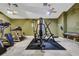 Community fitness center equipped with cardio machines, weight machines, and ceiling fans at 932 Emerald Green Ct, Kissimmee, FL 34746