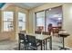 A cozy outdoor patio features a table and chairs for enjoying meals or gathering with friends at 932 Emerald Green Ct, Kissimmee, FL 34746