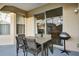 Outdoor patio with seating and a grill at 932 Emerald Green Ct, Kissimmee, FL 34746