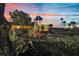 Community playground, nestled in a park-like setting with a colorful sunset at 932 Emerald Green Ct, Kissimmee, FL 34746