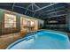 A gorgeous screened-in pool and backyard area offers a perfect space to relax at night at 932 Emerald Green Ct, Kissimmee, FL 34746
