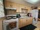 Functional kitchen with plenty of cabinet storage, appliances, and natural light at 1617 Emmett St, Kissimmee, FL 34741