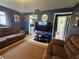 Relaxing living room boasts tile floors, sofa seating, flat screen television, and plenty of natural light at 1617 Emmett St, Kissimmee, FL 34741