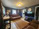Comfortable living room featuring tile floors, sofa seating, and television at 1617 Emmett St, Kissimmee, FL 34741