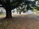 Spacious backyard with mature trees, well-maintained lawn, and a welcoming outdoor setting at 527 Stillwater Dr, Oviedo, FL 32765
