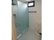 Modern bathroom with frosted glass shower, rainfall shower head and sleek fixtures at 527 Stillwater Dr, Oviedo, FL 32765