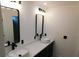 Stylish bathroom featuring dual vessel sinks, dark cabinetry, and modern fixtures at 527 Stillwater Dr, Oviedo, FL 32765