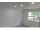 Well-lit bedroom with fresh paint, modern lighting, and wood-look flooring at 527 Stillwater Dr, Oviedo, FL 32765