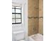 Well-lit bathroom with a tiled shower, modern fixtures, and a window at 10330 Turkey Lake Rd # A-4 Ak/A 107, Orlando, FL 32819