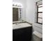 Bathroom featuring a modern sink, vanity, mirror, and tiled shower at 10330 Turkey Lake Rd # A-4 Ak/A 107, Orlando, FL 32819