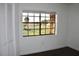Bedroom featuring large window with a scenic view of the outdoors and beautiful dark floors at 10330 Turkey Lake Rd # A-4 Ak/A 107, Orlando, FL 32819
