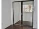 Bedroom closet with sliding doors and hardwood floors at 10330 Turkey Lake Rd # A-4 Ak/A 107, Orlando, FL 32819
