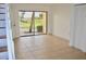 Inviting living room with tile flooring, natural light, and a sliding glass door to an outdoor space at 10330 Turkey Lake Rd # A-4 Ak/A 107, Orlando, FL 32819