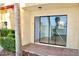 Exterior patio includes tiling, hedges, landscaping and view to interior sliding glass door at 10330 Turkey Lake Rd # A-4 Ak/A 107, Orlando, FL 32819