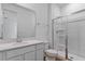 Modern bathroom with a sleek vanity, glass-enclosed shower, and contemporary fixtures at 1126 Olivine Ave, Dundee, FL 33838