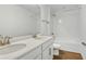 Bathroom featuring double sink vanity with modern fixtures, and a shower-tub combo at 1650 Sugarbelle Cir, Mascotte, FL 34753
