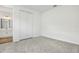 Cozy room with plush carpeting, a closet, and a peek into an ensuite bathroom at 1650 Sugarbelle Cir, Mascotte, FL 34753