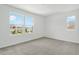 Bedroom with gray carpet and large windows offering great neighborhood views at 1650 Sugarbelle Cir, Mascotte, FL 34753