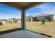 View of the backyard from the covered porch at 1690 Sugarbelle Cir, Mascotte, FL 34753