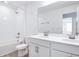 Bright bathroom with double vanity, bathtub, shower, and toilet at 1690 Sugarbelle Cir, Mascotte, FL 34753