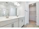 Bright bathroom features double vanity sinks and shower with glass doors at 1690 Sugarbelle Cir, Mascotte, FL 34753