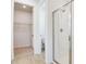 Bright bathroom features shower with glass doors and tiled walls at 1690 Sugarbelle Cir, Mascotte, FL 34753