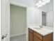 Bathroom featuring a single sink vanity with white countertops and tiled flooring at 204 Bella Cortina Dr, Poinciana, FL 34759