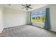 Bright primary bedroom with large window showcasing backyard view at 204 Bella Cortina Dr, Poinciana, FL 34759
