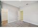 Bedroom with neutral carpet, and access to the bathroom and walk-in closet at 204 Bella Cortina Dr, Poinciana, FL 34759