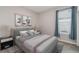 Cozy bedroom features neutral walls, carpet, window and nice furnishings at 204 Bella Cortina Dr, Poinciana, FL 34759