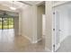 Hallway leading into an open living space with a great view of the backyard at 204 Bella Cortina Dr, Poinciana, FL 34759