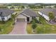 Charming single-Gathering home with a well-manicured lawn and a brick paver driveway at 204 Bella Cortina Dr, Poinciana, FL 34759