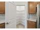 Walk-in pantry with white wire shelving for optimal storage and organization at 204 Bella Cortina Dr, Poinciana, FL 34759