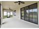 Covered patio with ceiling fans, sliding glass doors, and a view of the yard at 204 Bella Cortina Dr, Poinciana, FL 34759