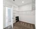 This spacious walk-in closet features an open wire shelving system and carpeted floors at 204 Bella Cortina Dr, Poinciana, FL 34759