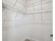 Bright walk-in closet with white walls, shelving units, and concrete floors at 204 Bella Cortina Dr, Poinciana, FL 34759