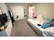 Cozy bedroom with carpet, a comfortable bed, and ample closet space at 4871 Coral Castle Dr, Kissimmee, FL 34746