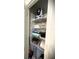 A well-organized closet with wire shelving stacked with folded towels and linens, with other storage items at 4871 Coral Castle Dr, Kissimmee, FL 34746
