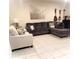 Comfortable living room with large sofa, accent chairs, and neutral decor at 4871 Coral Castle Dr, Kissimmee, FL 34746