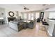 Spacious living room with tile floors, a fireplace, comfortable seating, and a view of the dining area at 4871 Coral Castle Dr, Kissimmee, FL 34746