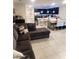 Open-concept living space with modern kitchen, dining area, and comfortable living room furnishings at 4871 Coral Castle Dr, Kissimmee, FL 34746