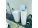 Home's water softening system and filtration equipment outside at 4871 Coral Castle Dr, Kissimmee, FL 34746
