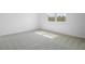 Bright bedroom with neutral carpet and a large window at 6385 Clover St, Lake Hamilton, FL 33851