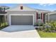 Charming one-story home with a two-car garage, landscaped yard and neutral exterior at 6385 Clover St, Lake Hamilton, FL 33851