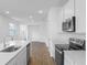 Spacious kitchen featuring stainless steel appliances and quartz countertops at 6385 Clover St, Lake Hamilton, FL 33851